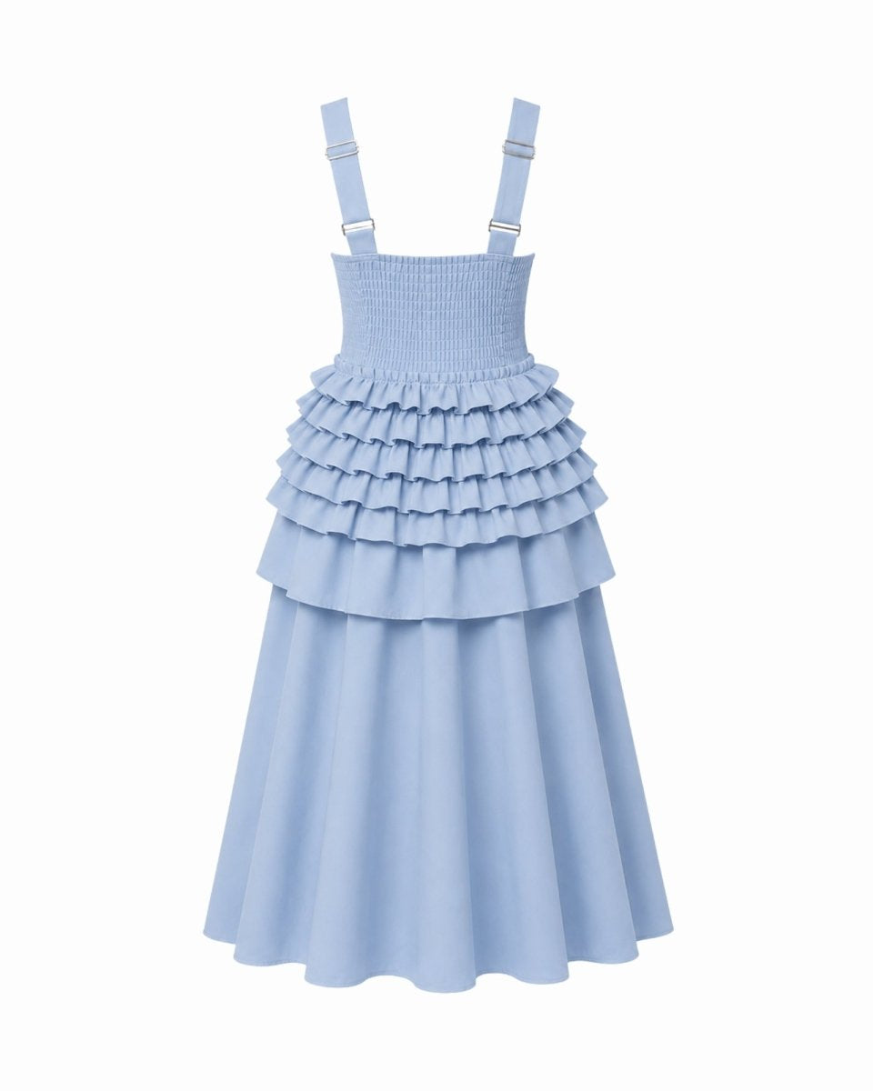 A light blue sleeveless dress with shoulder straps, a smocked bodice, and a tiered ruffle skirt, shown against a plain white background.