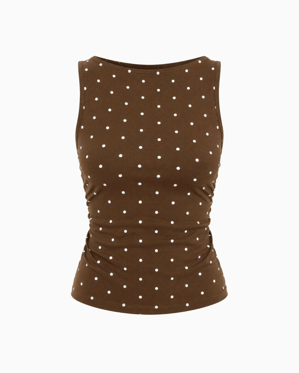 A sleeveless brown top with a white polka dot pattern, shown against a plain white background.