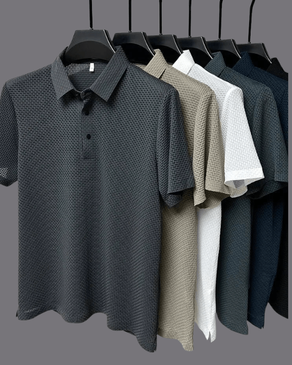 Collection of patterned polo shirts on hangers against a gray background
