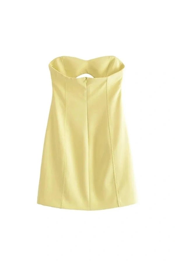 Model wearing the Kouvr Fashion yellow strapless cutout mini dress from the front