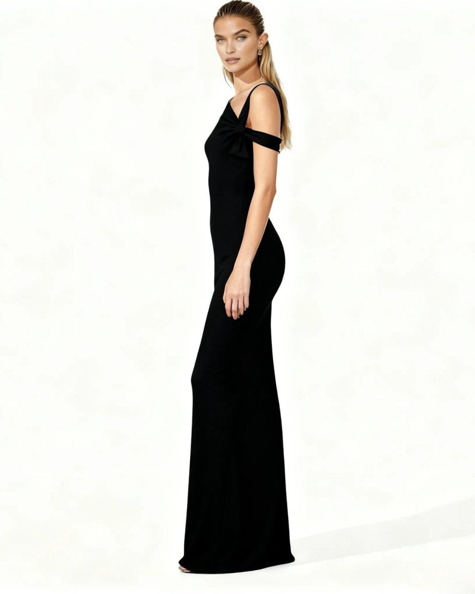 Woman wearing a black evening gown on a white background