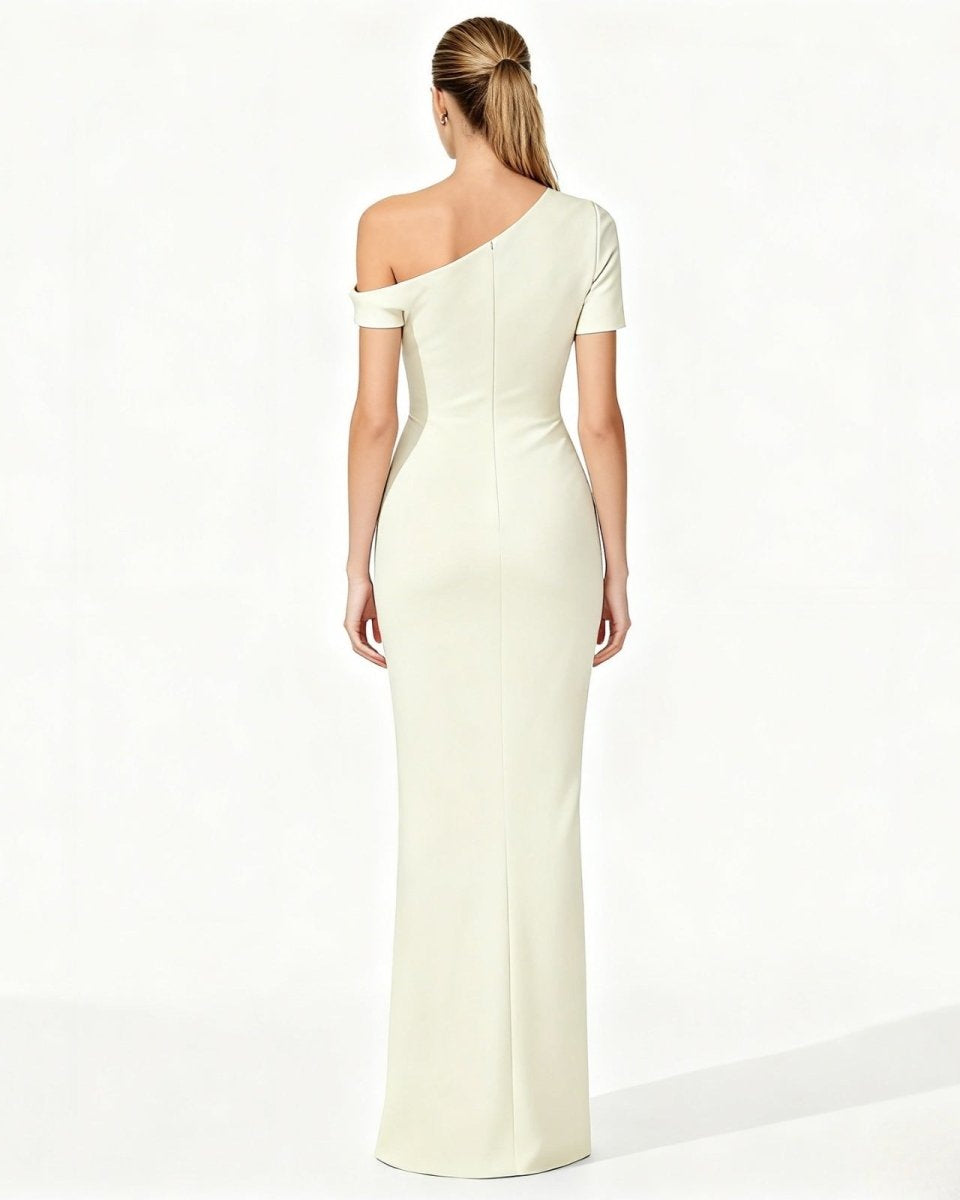 Woman wearing a one-shoulder white dress on a white background