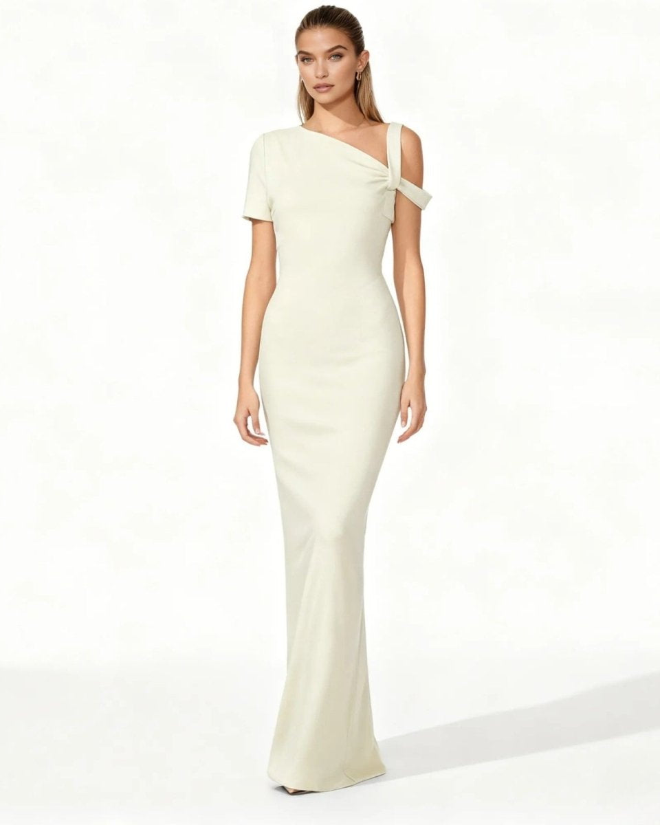 Woman wearing a one-shoulder white dress on a white background