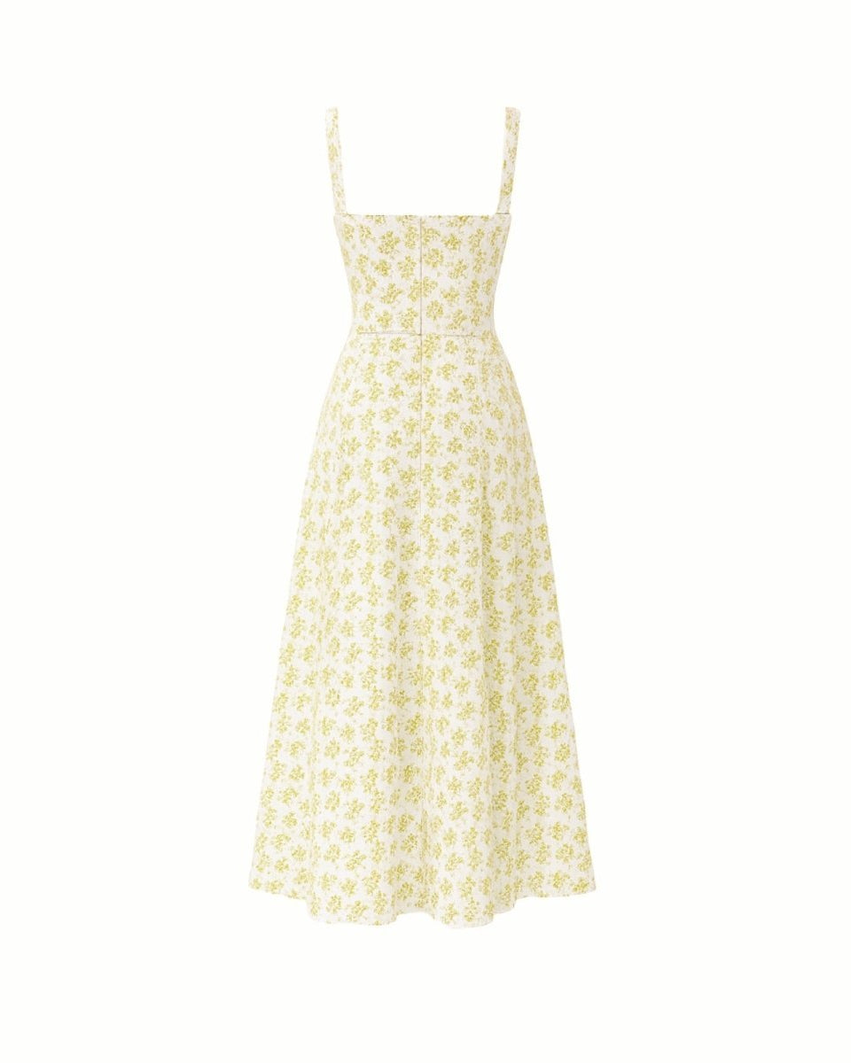 Close-up detail of the sweetheart neckline, tie-front feature, and jacquard fabric of the yellow rose floral midi dress.