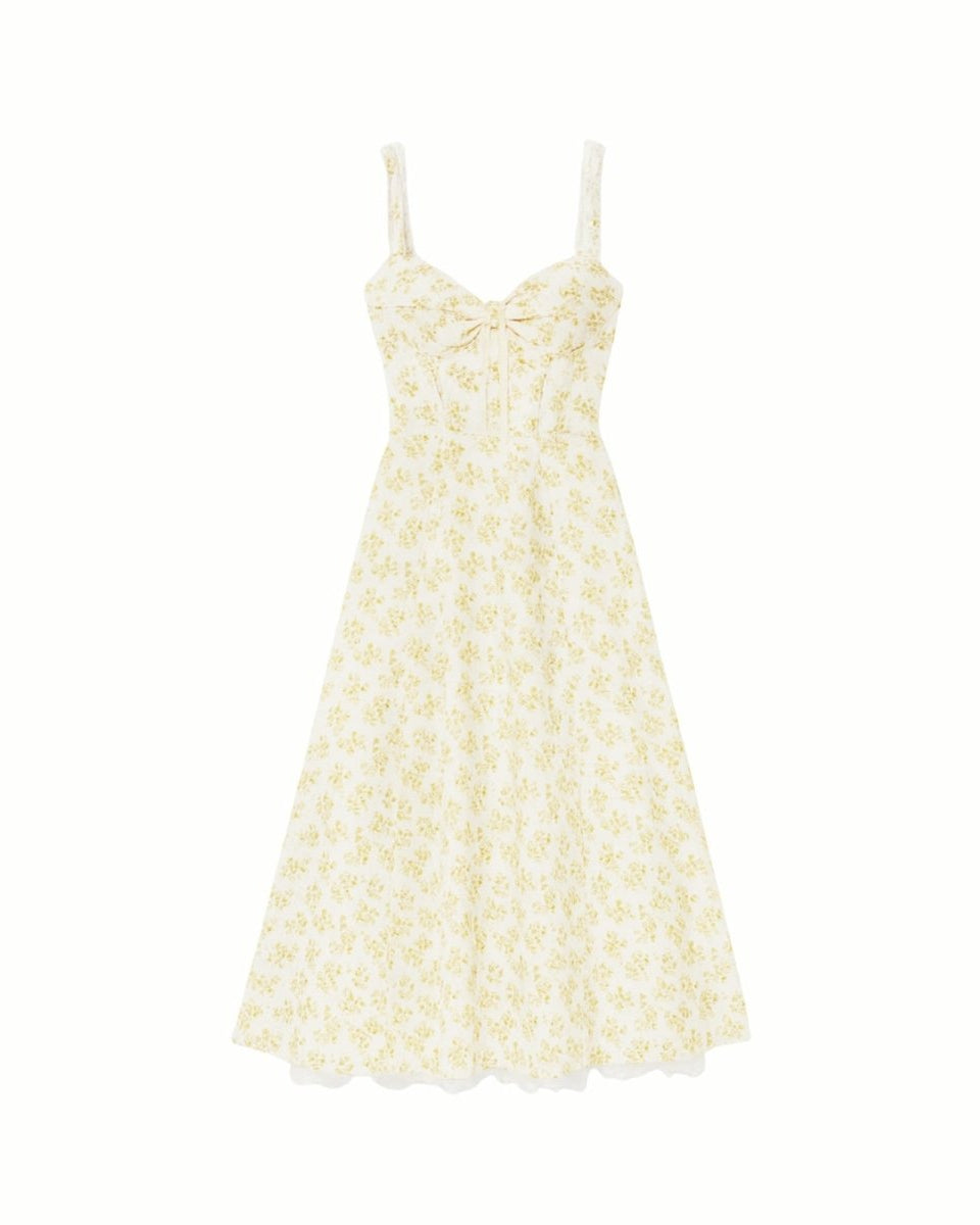 Close-up detail of the sweetheart neckline, tie-front feature, and jacquard fabric of the yellow rose floral midi dress.