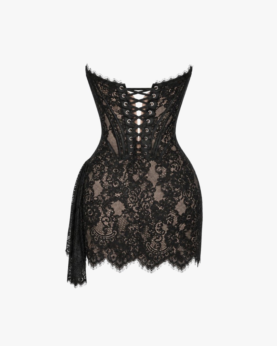 Black lace corset top with floral lace pattern, lace-up back, and scalloped edges, shown against a plain light gray background.