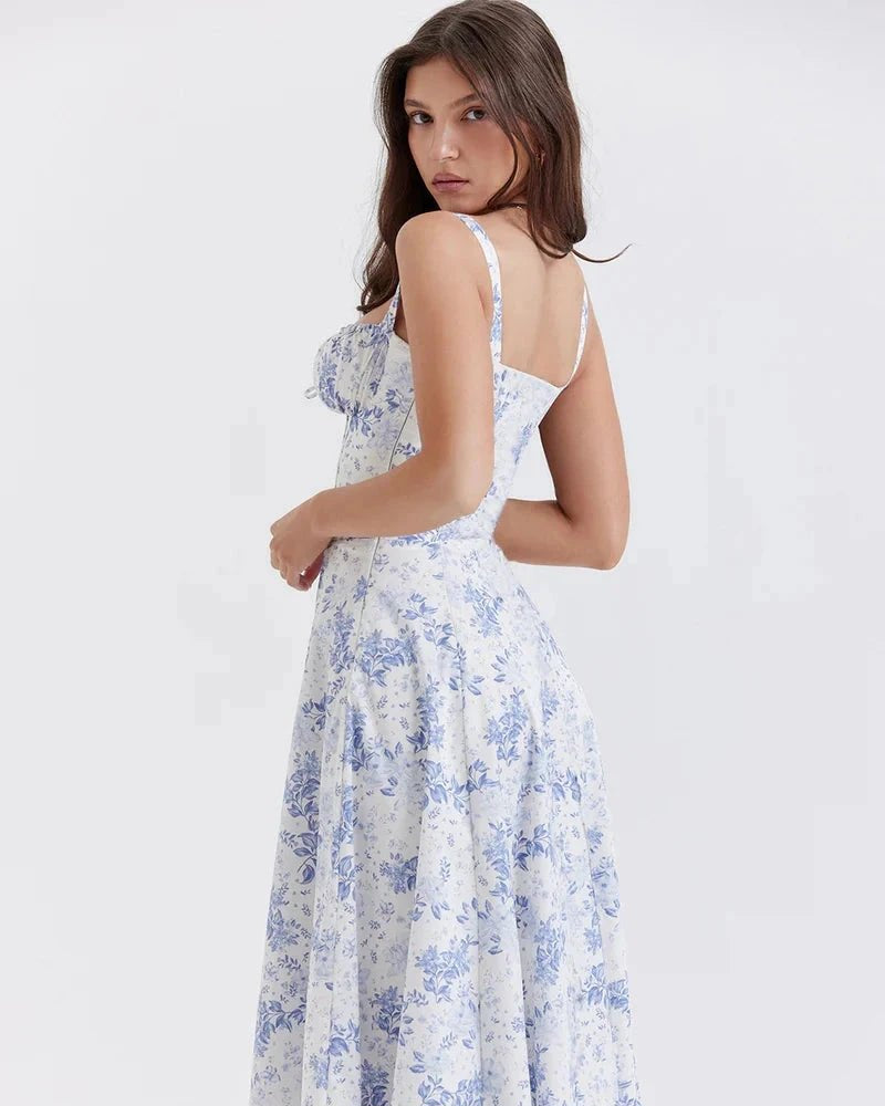 Woman wearing a white floral dress on a white background