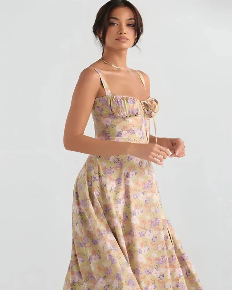 Woman wearing a floral dress on a plain background