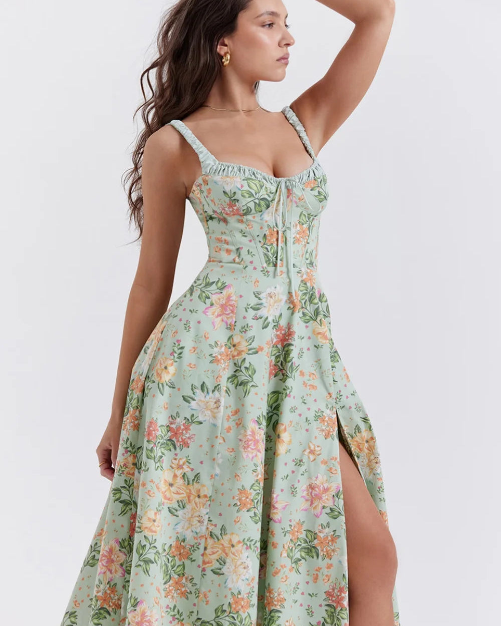 Woman wearing a floral dress with a white background