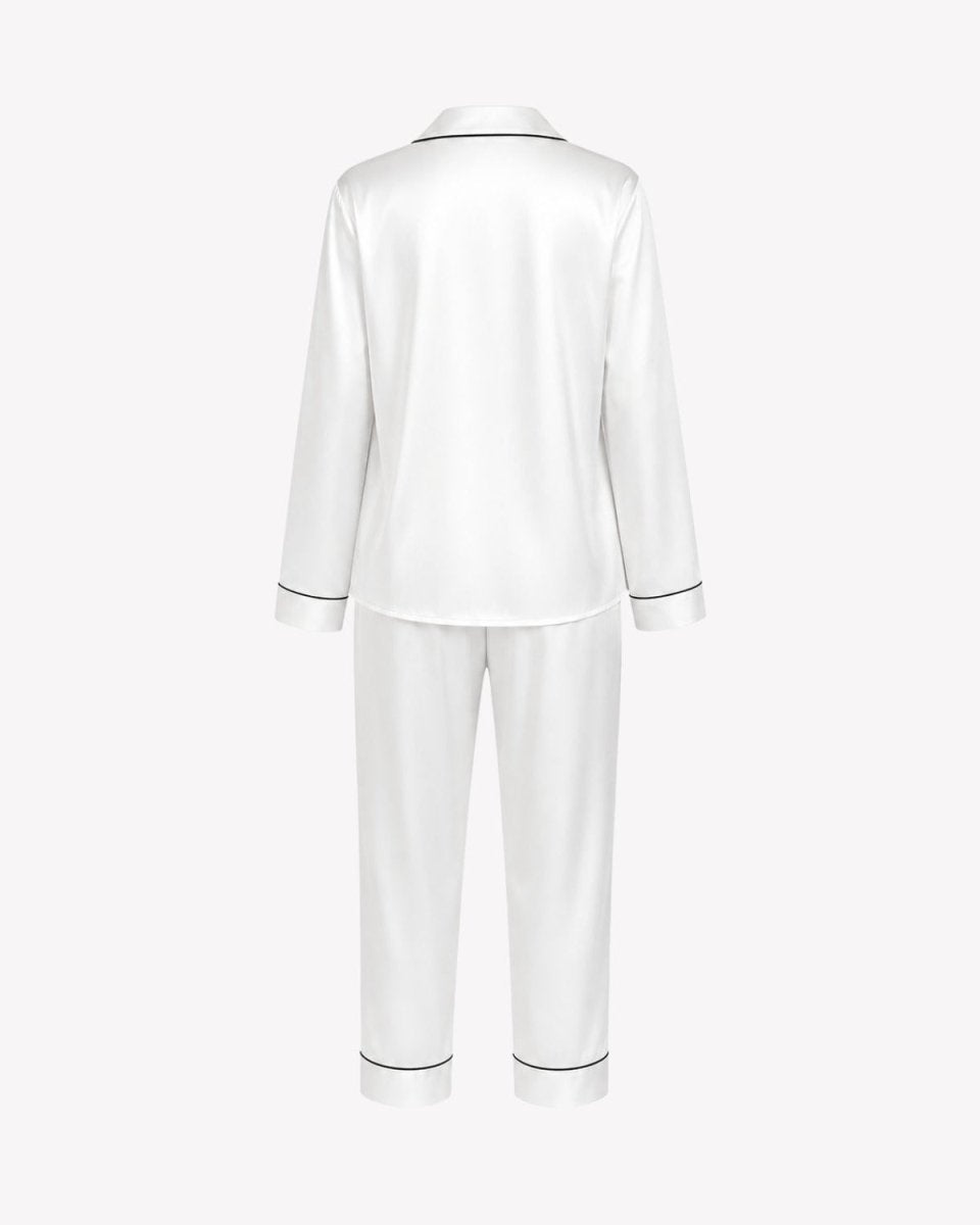 White satin pajama set with a long-sleeve top and matching pants, shown from the back on a light gray background.