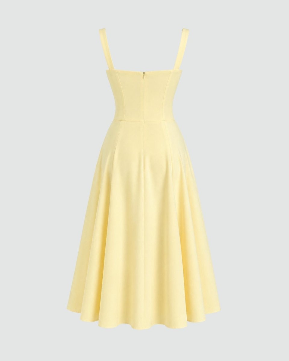 A pale yellow sleeveless midi dress with thin shoulder straps, a structured sweetheart neckline, a fitted waist, and a flared skirt, shown on a light gray background.
