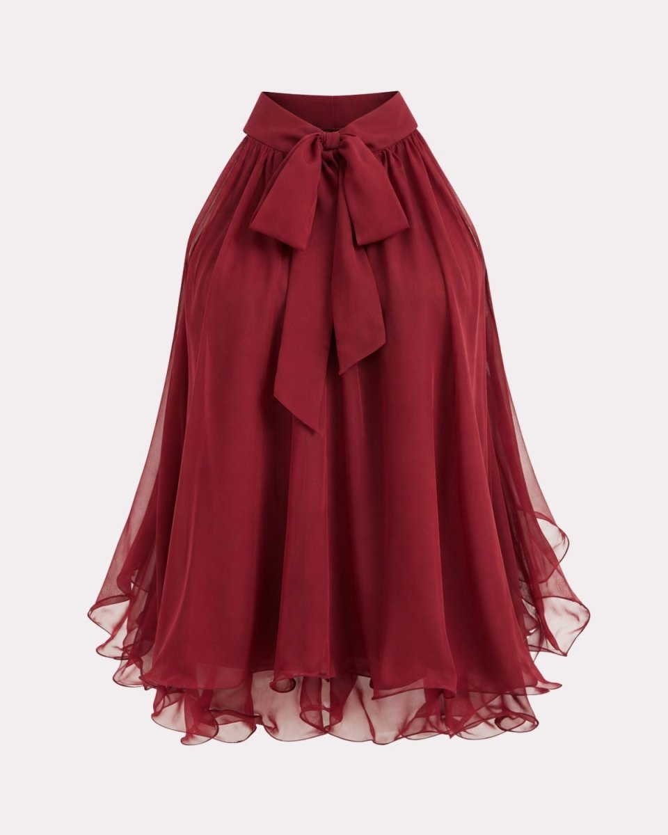 A high-waisted, flowy midi skirt in deep burgundy red, featuring a matching fabric tie belt at the waist and a layered, sheer ruffled hem, shown against a light gray background.