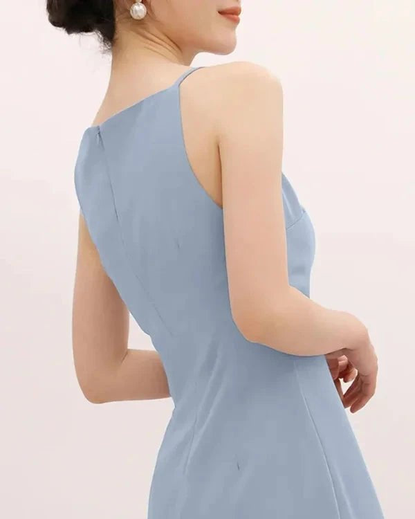 Light blue dress worn by a person on a plain background