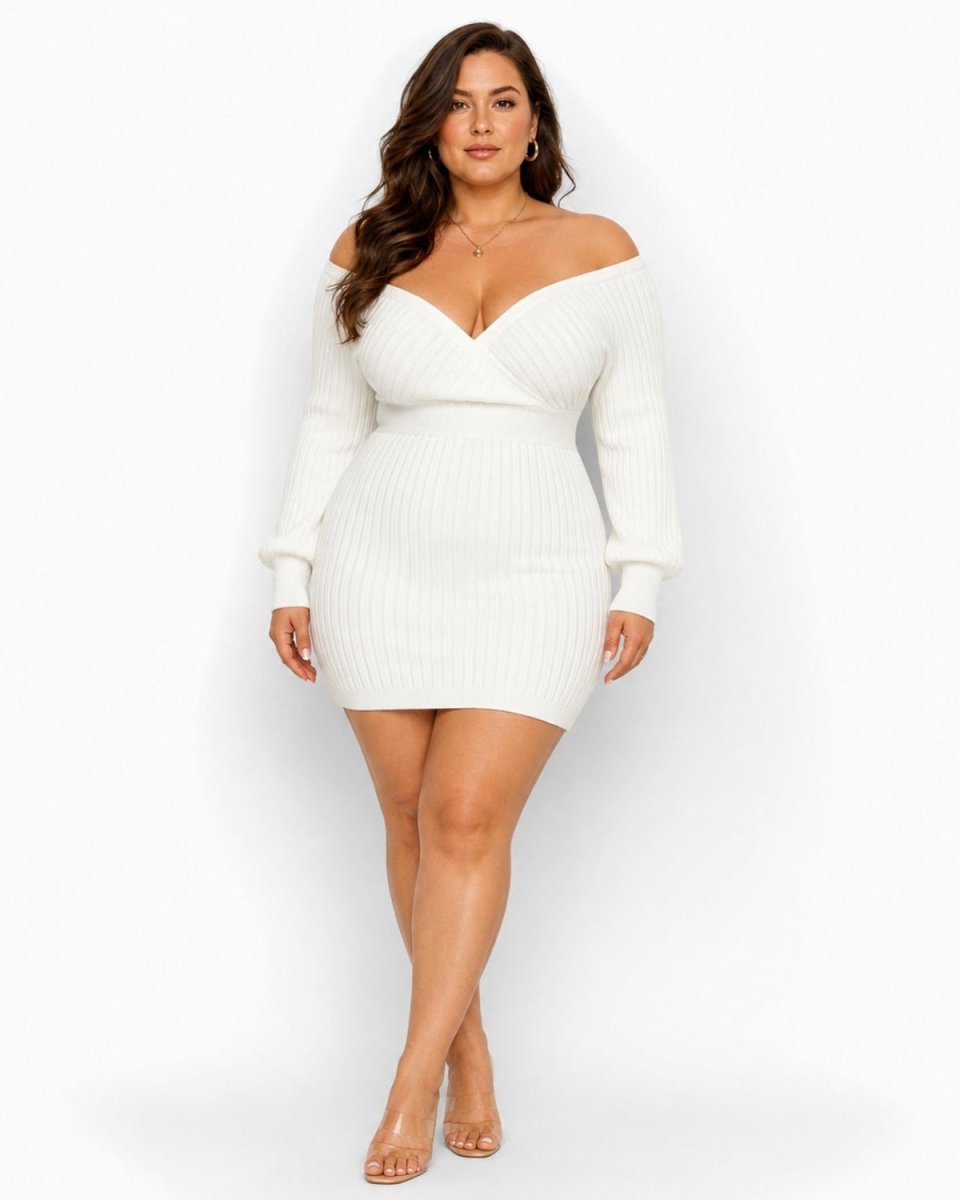 A woman modeling a white off-the-shoulder ribbed knit mini dress with long sleeves, paired with clear high-heeled sandals, against a plain white studio background.