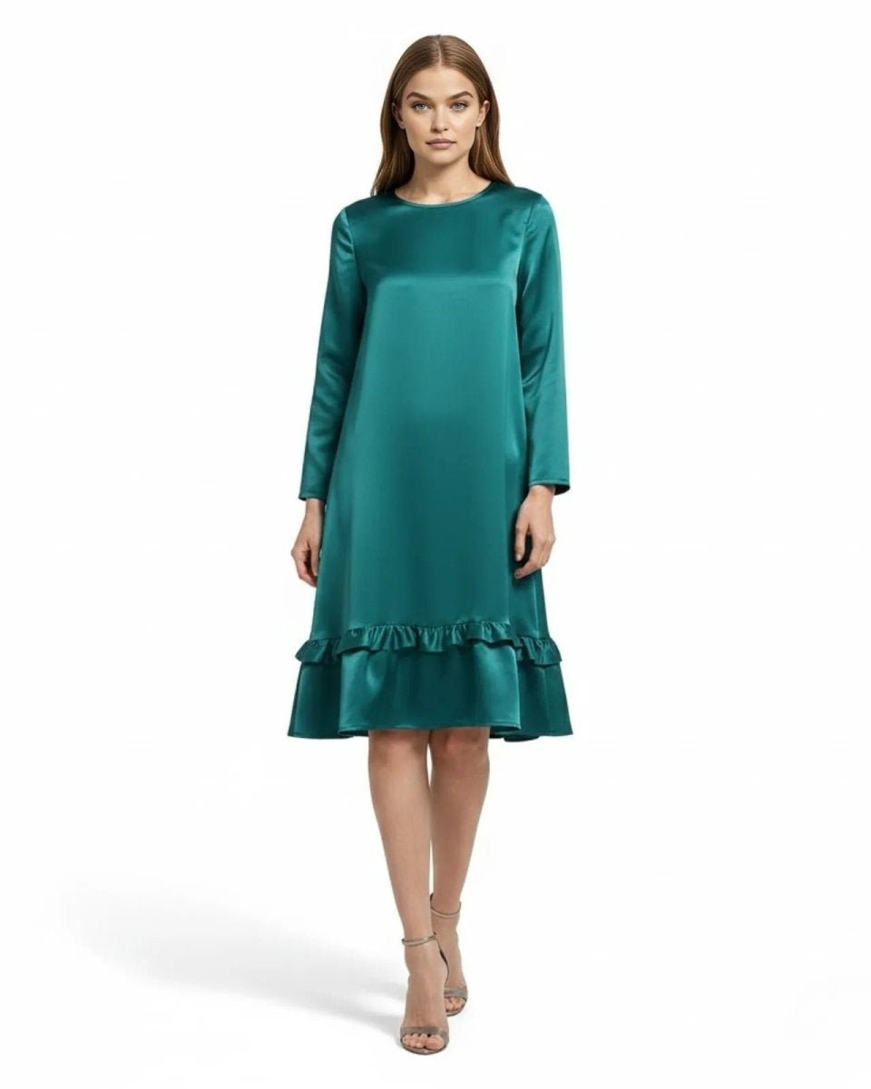 Model wearing the Adalee long sleeve teal satin dress with a ruffle hem, facing forward.