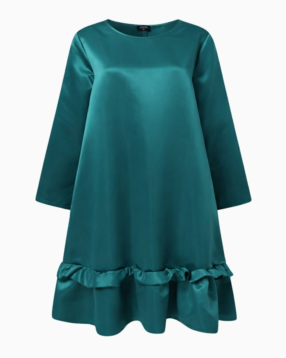 Front flatlay of the Adalee teal dress showcasing its crew neck, long sleeves, and ruffle hem.