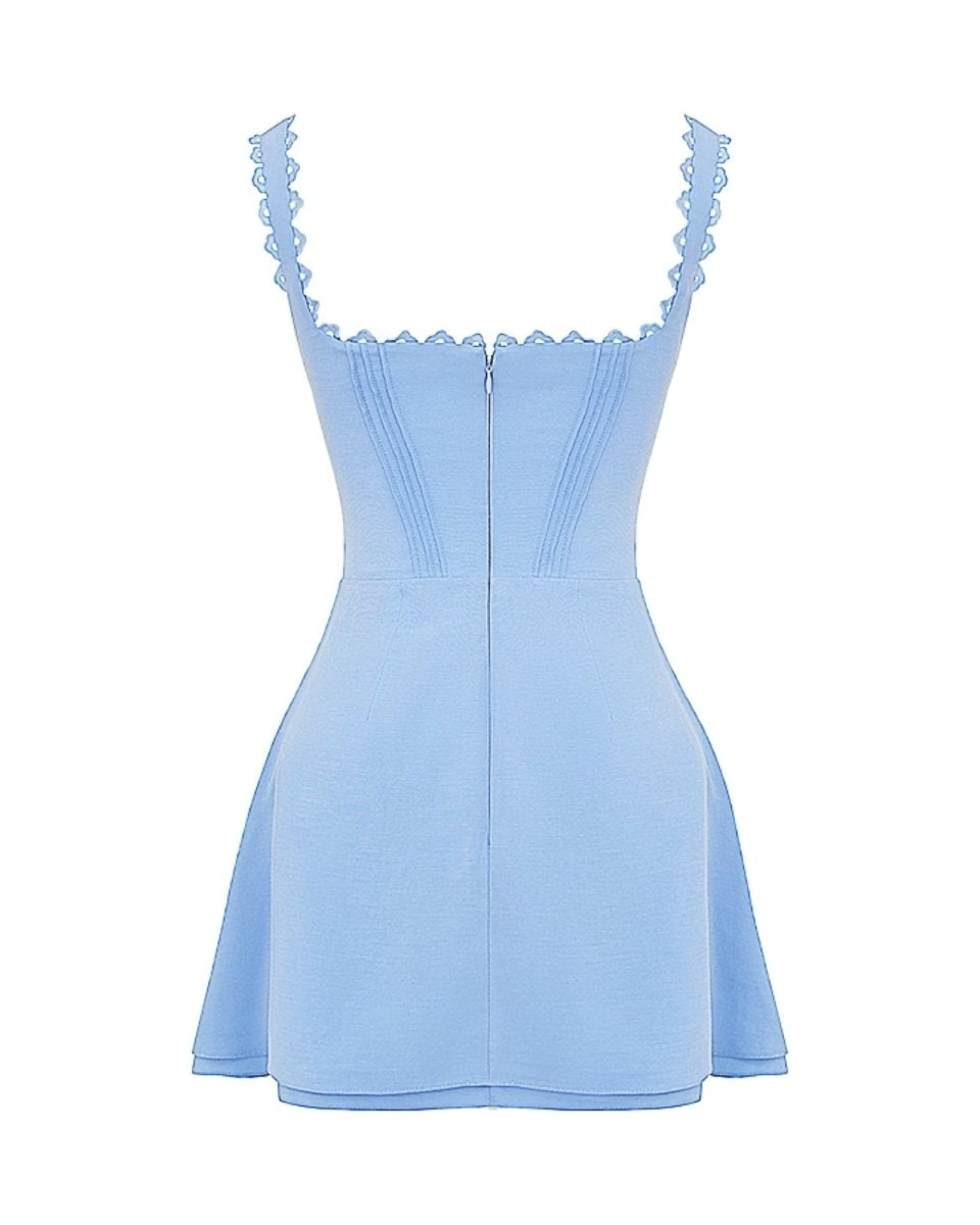 Product photo of the back of the Ariadne blue mini dress highlighting the zipper and strap construction.