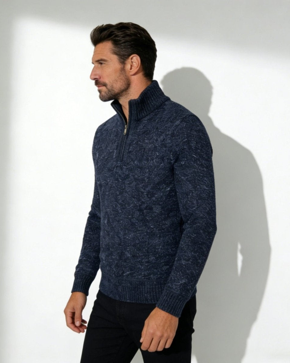 Man wearing the Elyson men's textured quarter-zip sweater in a deep navy marl, styled with black trousers.