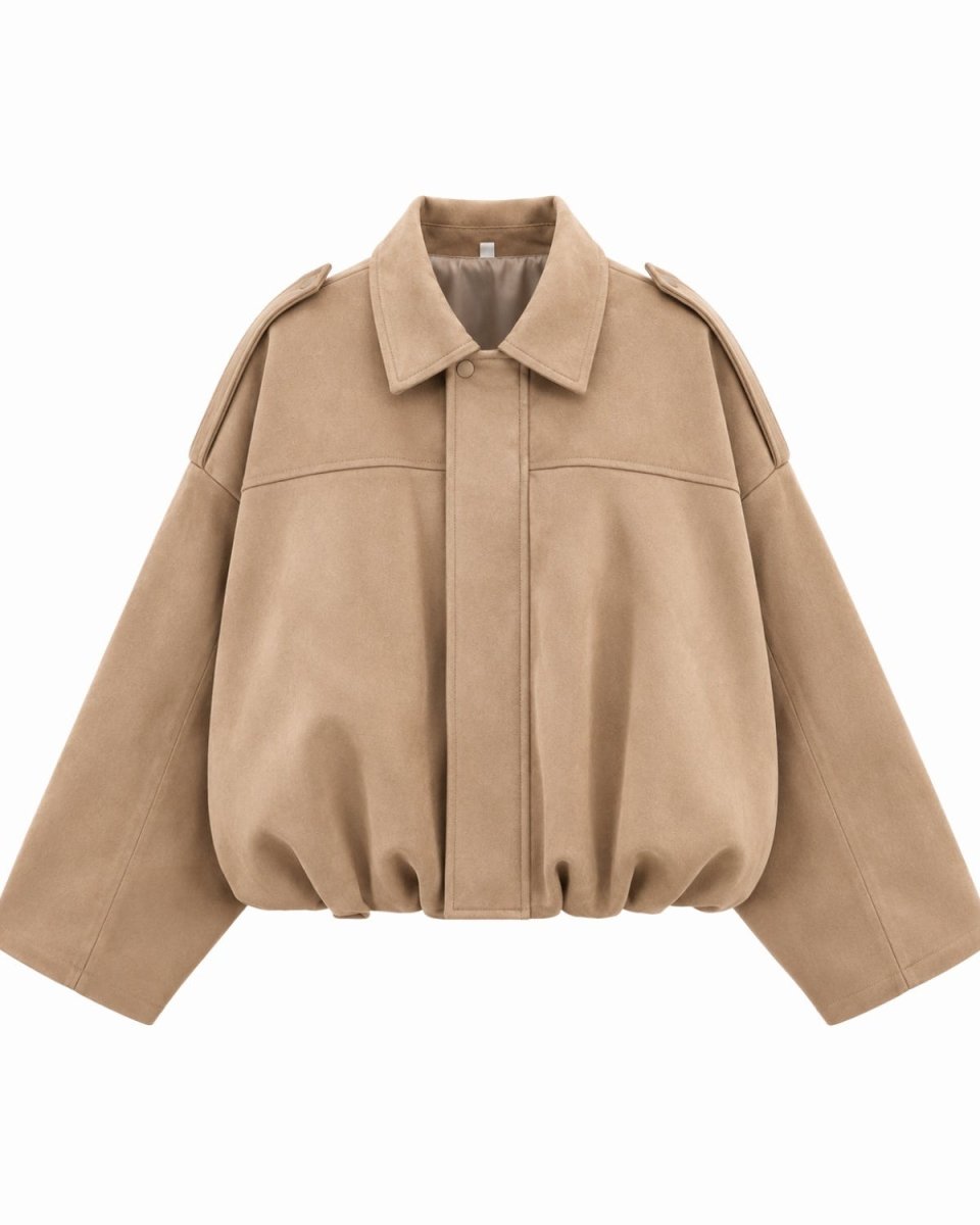 A cropped, oversized tan jacket with a pointed collar, button front, and shoulder epaulets, shown on a plain white background.