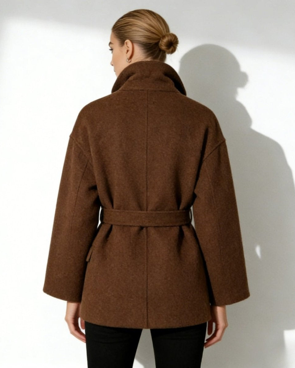 Back view of the short brown wool coat, highlighting the belt and minimalist construction.