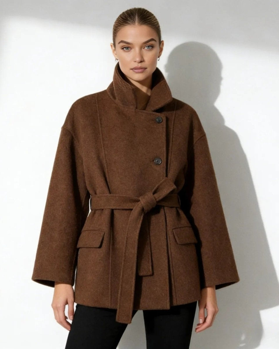 Model wearing the brown belted funnel neck wool jacket, tied at the waist.