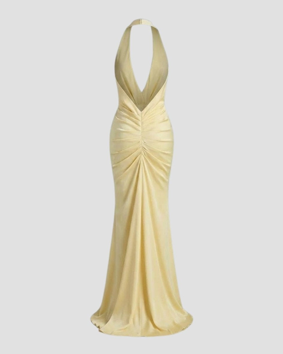 Flat lay of the back of the Beverly backless maxi dress in Light yellow, showing the adjustable halter ties and ruched back construction.