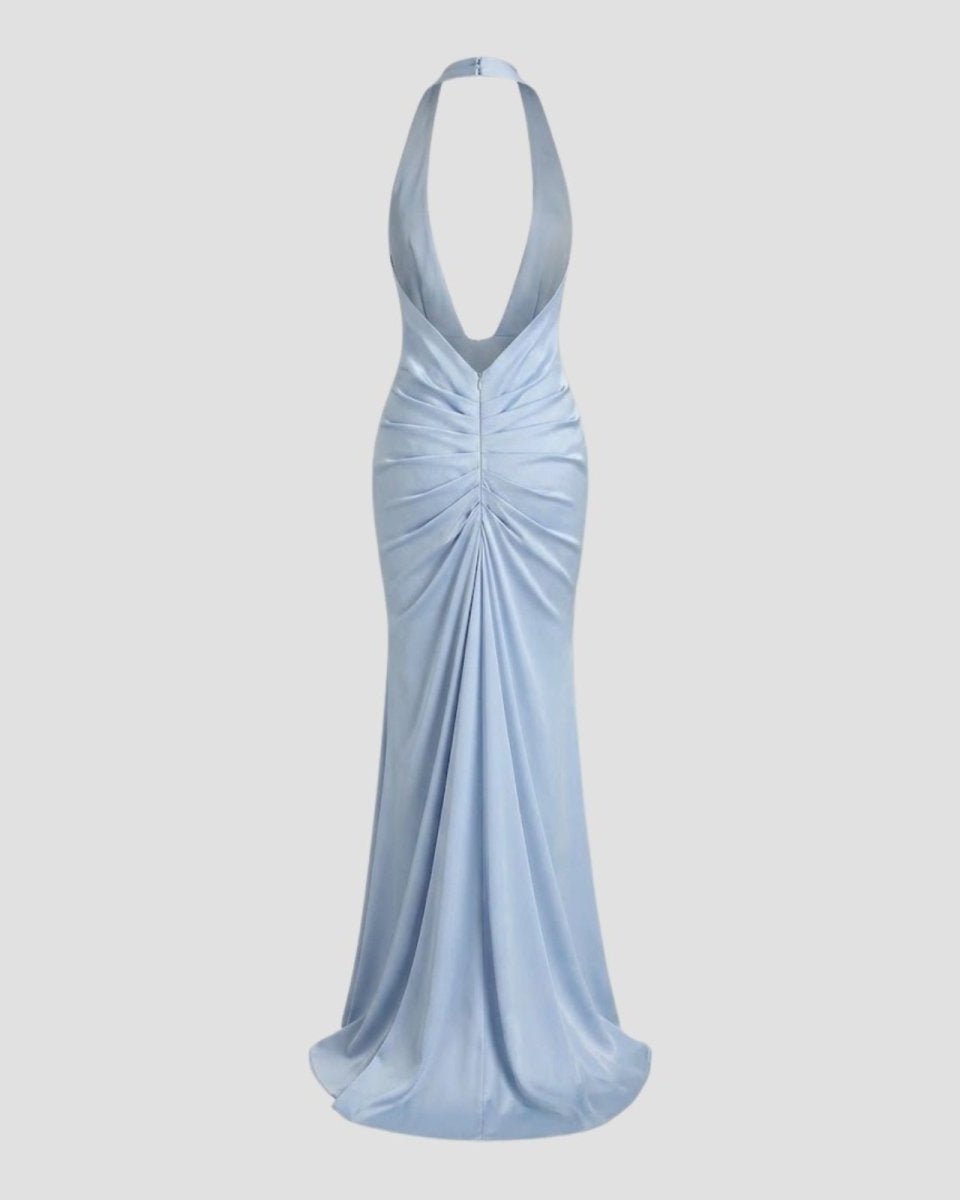 Flat lay product shot of the back of the Beverly light blue satin halter maxi dress, showing the open-back and ruching.
