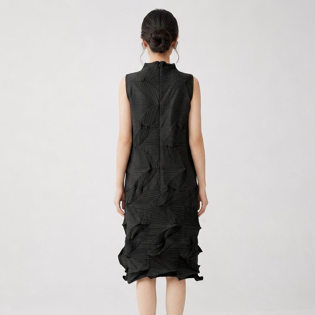 Back view of the black geometric textured sleeveless mock neck midi dress showing invisible zipper.