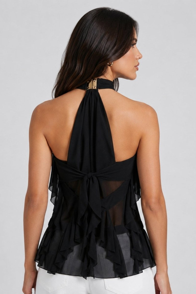 Back view of model wearing Fenlo Form black sleeveless evening top showcasing an elegant open back design with a self-tie chiffon bow.