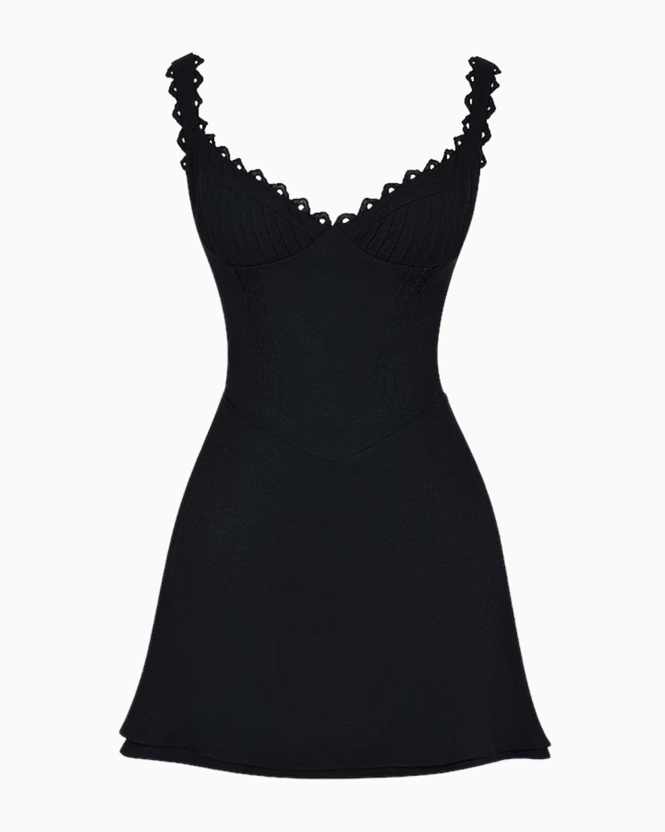 Flat lay of the black mini dress, providing a close-up of the sweetheart neckline, ribbed bust, and structured bodice.