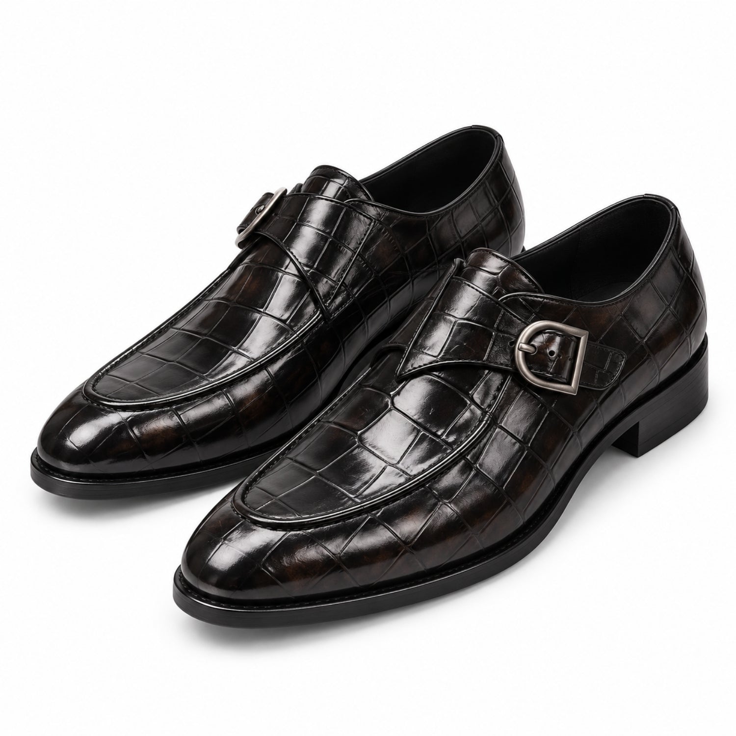 Pair of men's black crocodile embossed leather single monk strap dress shoes with silver buckle