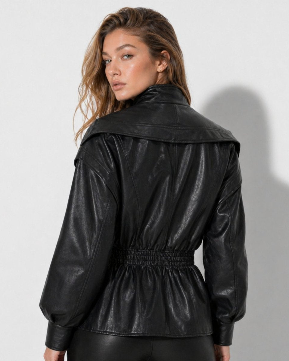 Back view of women's black faux leather jacket showing shirred elastic waist and draped collar styling
