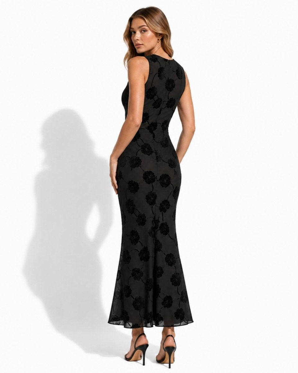 Back view of black flocked chiffon long cocktail dress showing seamless zipper