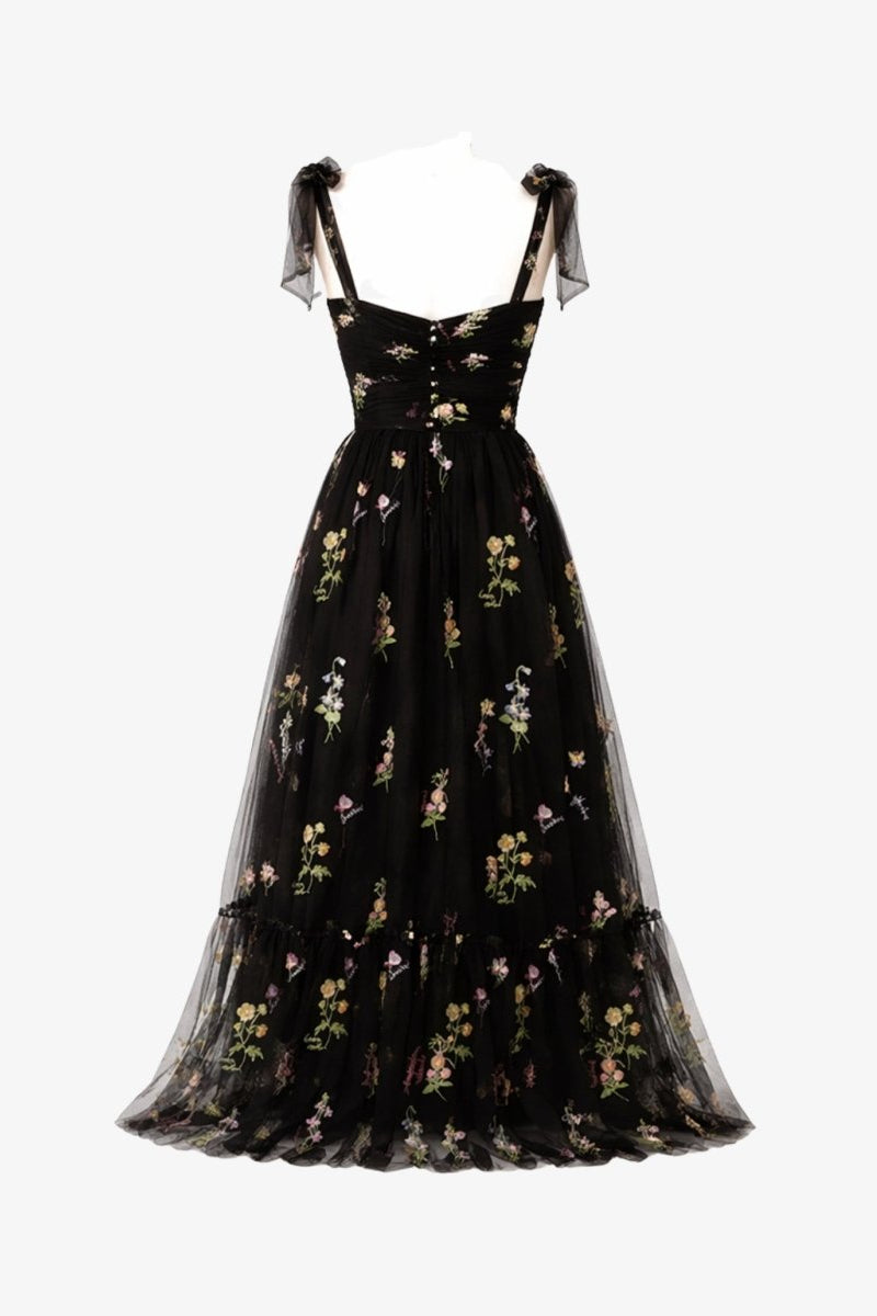 Ghost mannequin back view of Fenlo Form black tulle floral evening dress showing gathered skirt and back zipper details.