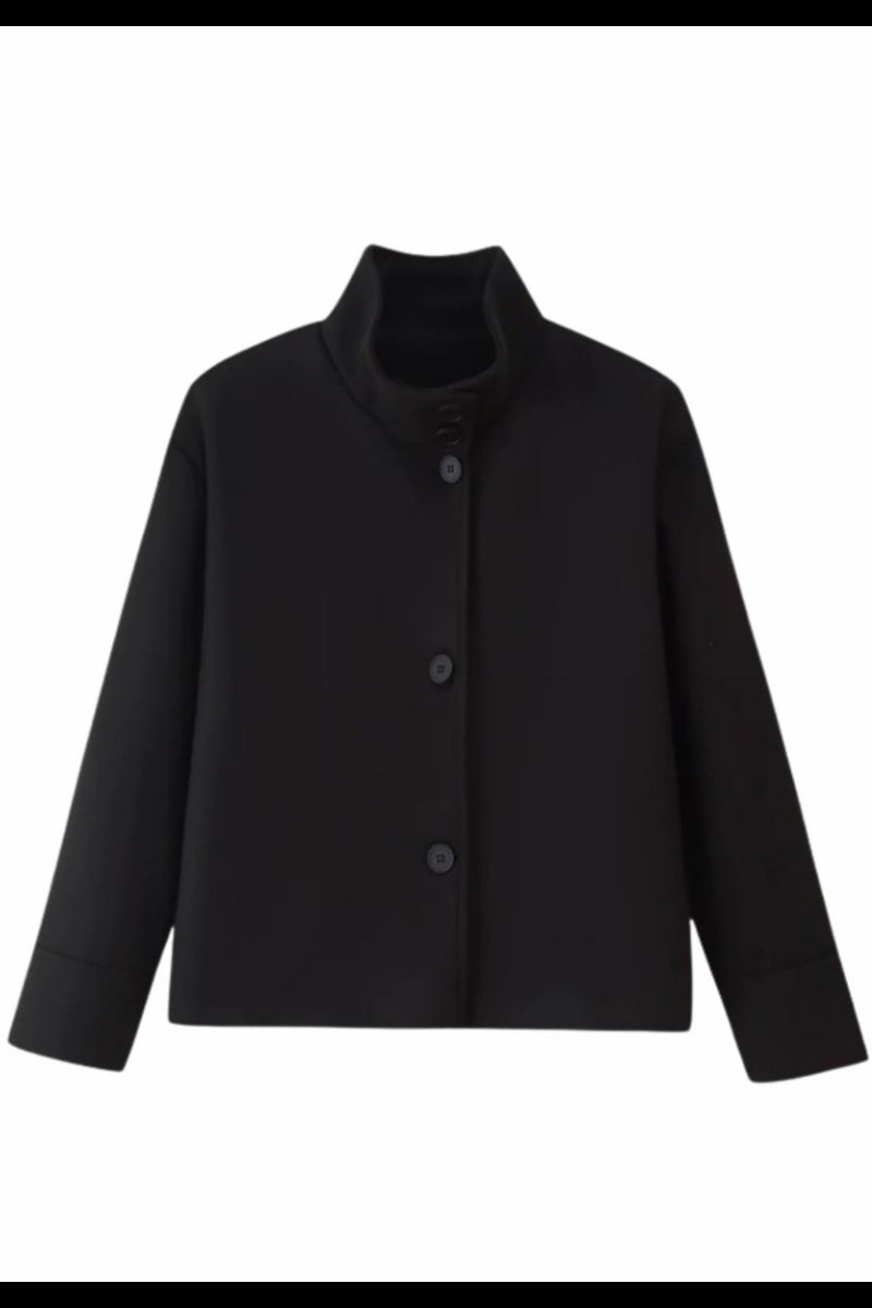 Ghost mannequin front view of the black funnel neck structured jacket highlighting the high collar and button closure.