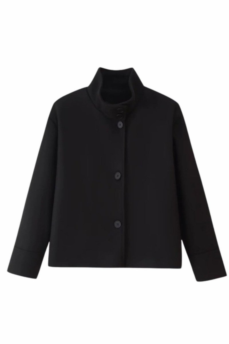 A black cropped jacket with a high stand collar and three front buttons, displayed on a clean white background.