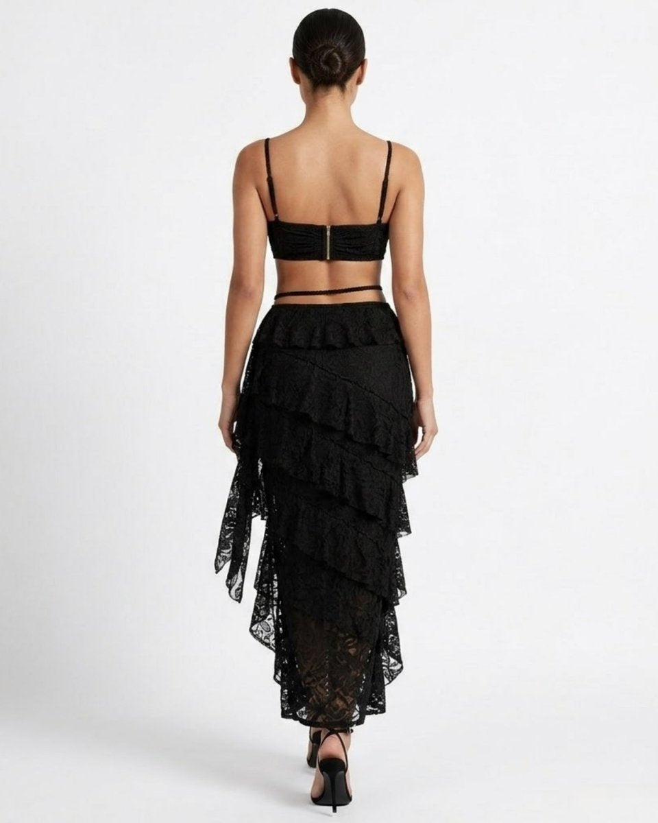 Back view of black lace co-ord showing exposed gold zipper on top and cascading sheer lace skirt layers