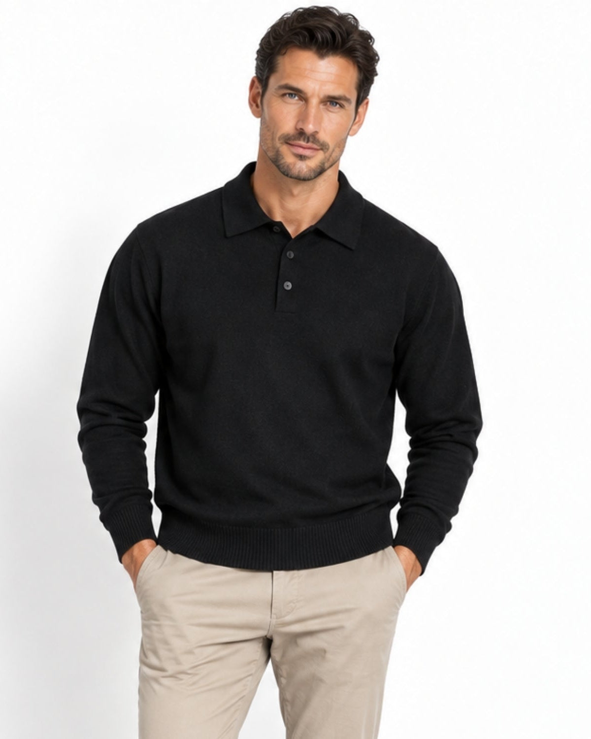 Male model wearing black long sleeve knit polo sweater with beige chinos, looking directly at camera.