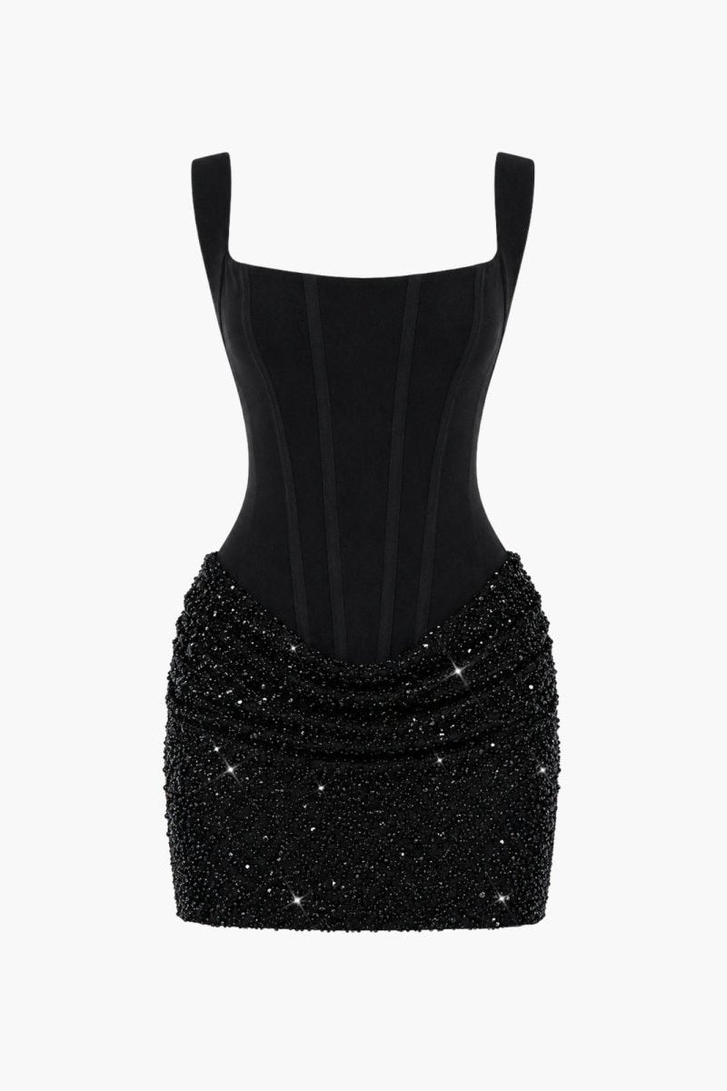 Flat lay product shot of black luxury corset mini dress with heavy sequin skirt embellishment.
