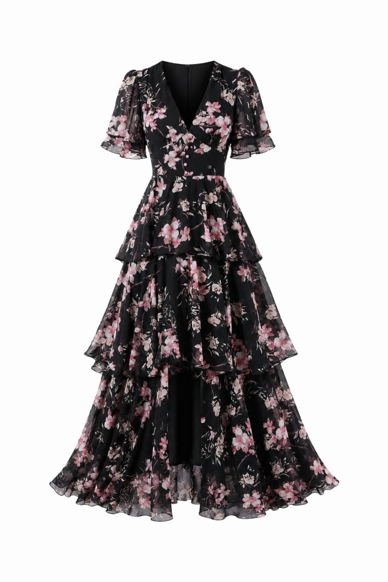 Studio product shot of black luxury tiered floral dress with elegant sweeping skirt