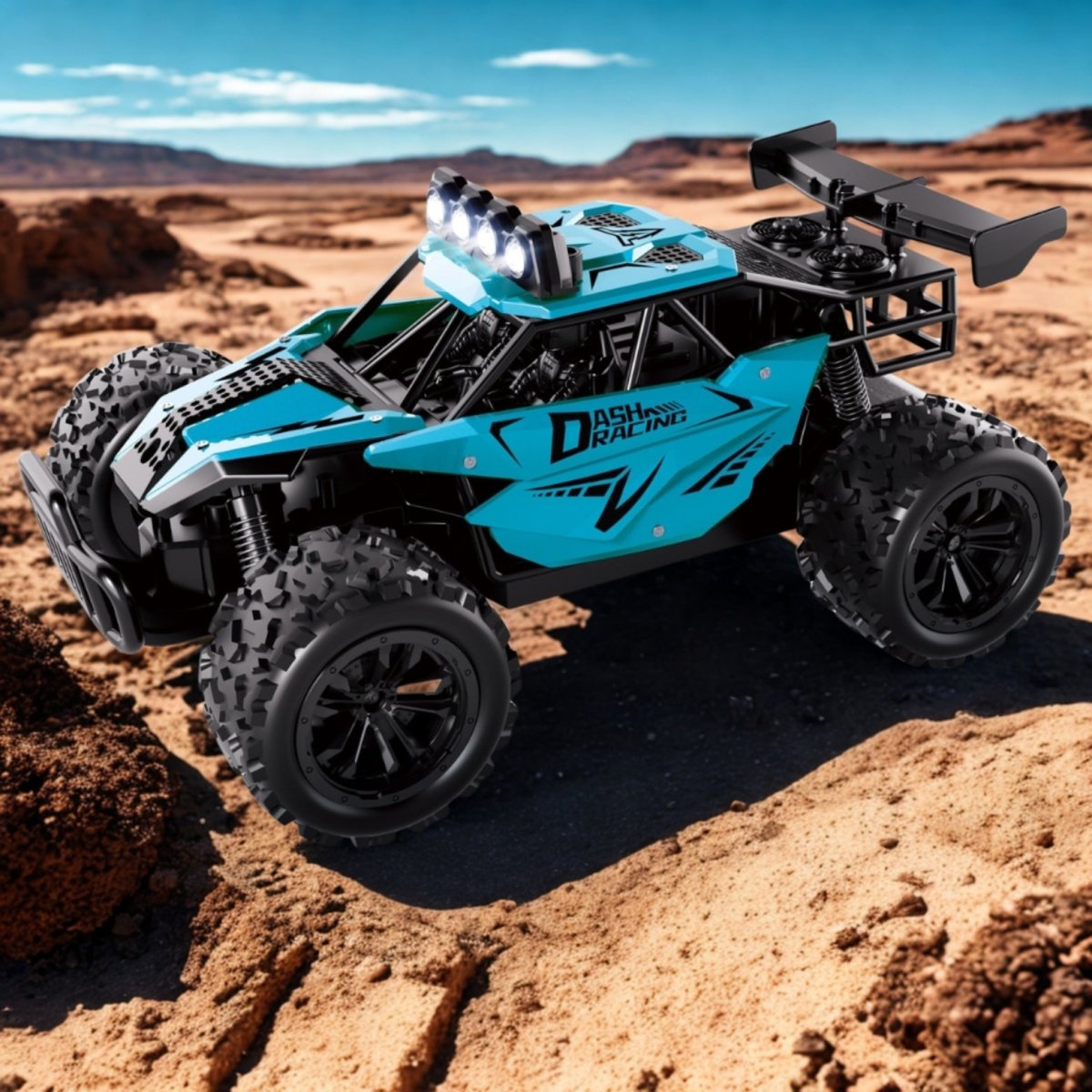 A blue 1:16 scale RC monster truck performing a high jump over desert rocks at sunset, with its LED headlights illuminated.