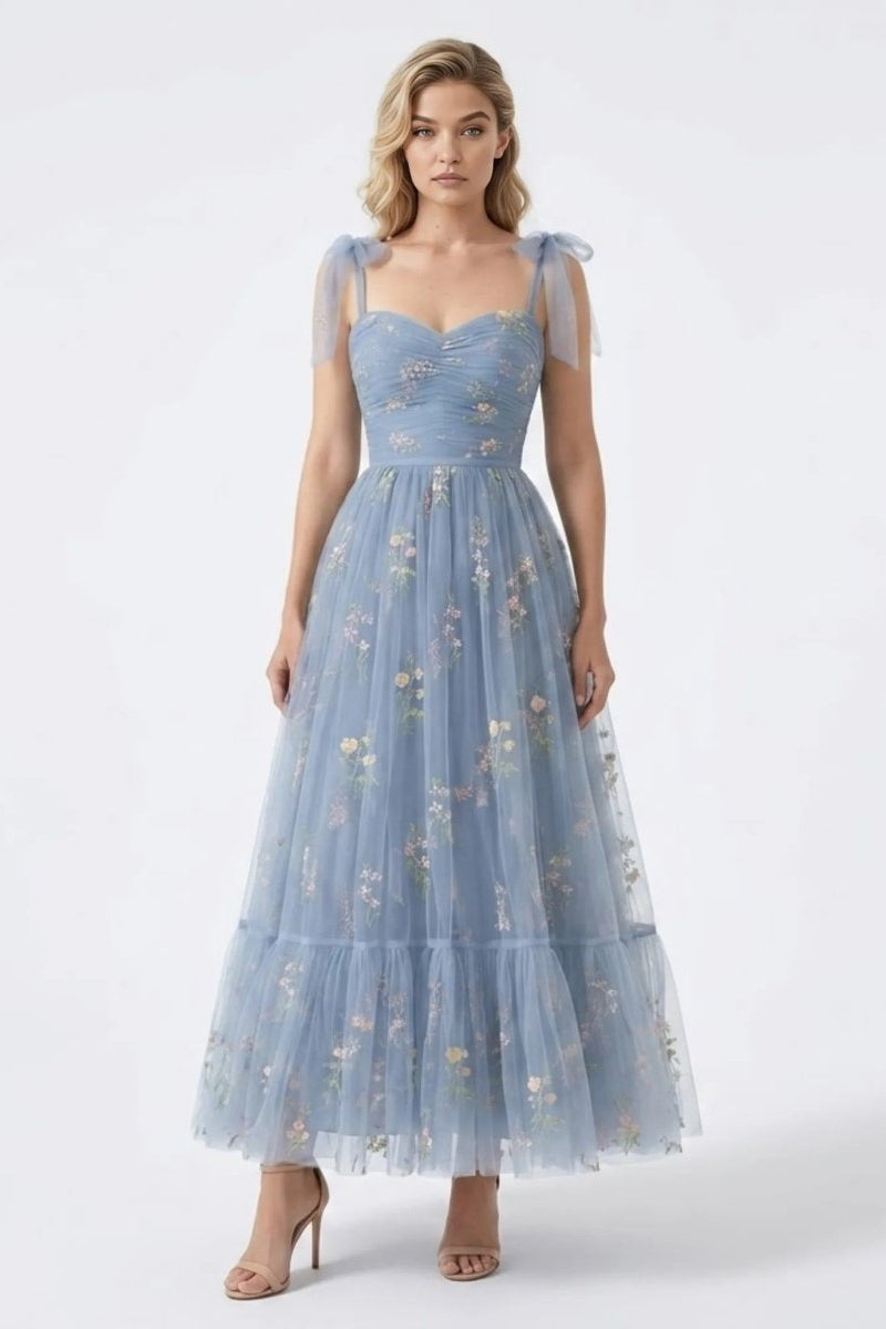 Front view of the Fenlo Form blue floral embroidered tulle maxi dress featuring sheer tie straps and a sweetheart ruched bodice.