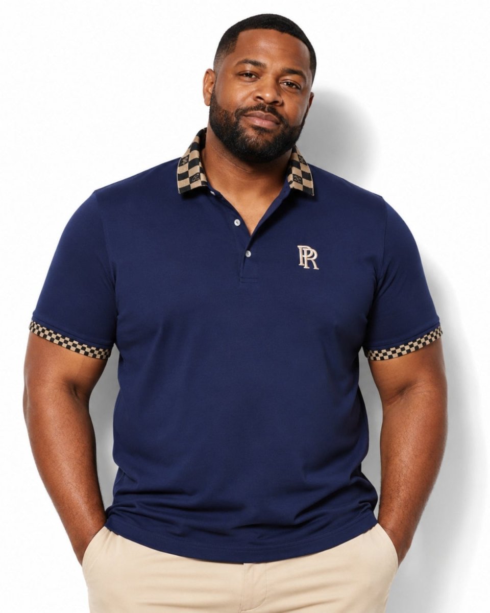 A man wearing a navy blue polo shirt with a beige and black checkered pattern on the collar and sleeve cuffs, featuring a small gold embroidered 'RR' logo on the chest. He is wearing beige pants against a clean white background.
