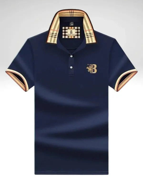 Navy blue polo shirt with gold accents on a light gray background
