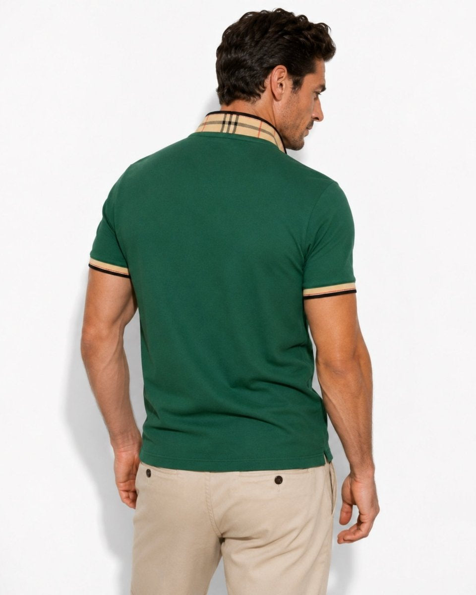 Man wearing a green polo shirt with a beige collar against a white background