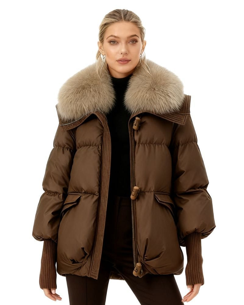 Brown fenlo form puffer jacket with fur collar worn by a model on a white background