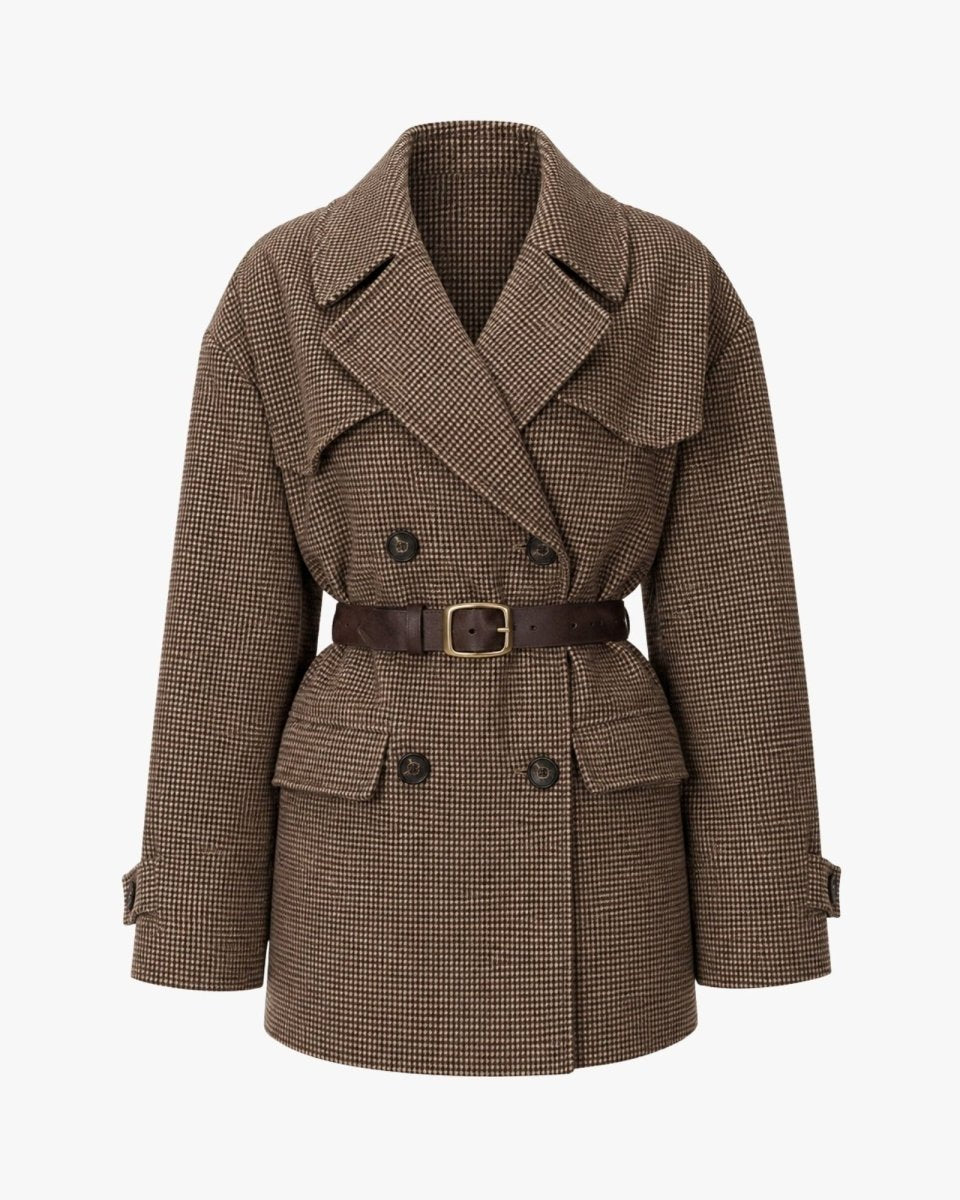 A brown double-breasted belted coat with a subtle houndstooth pattern, featuring a wide collar and flap pockets, shown on a plain light gray background.