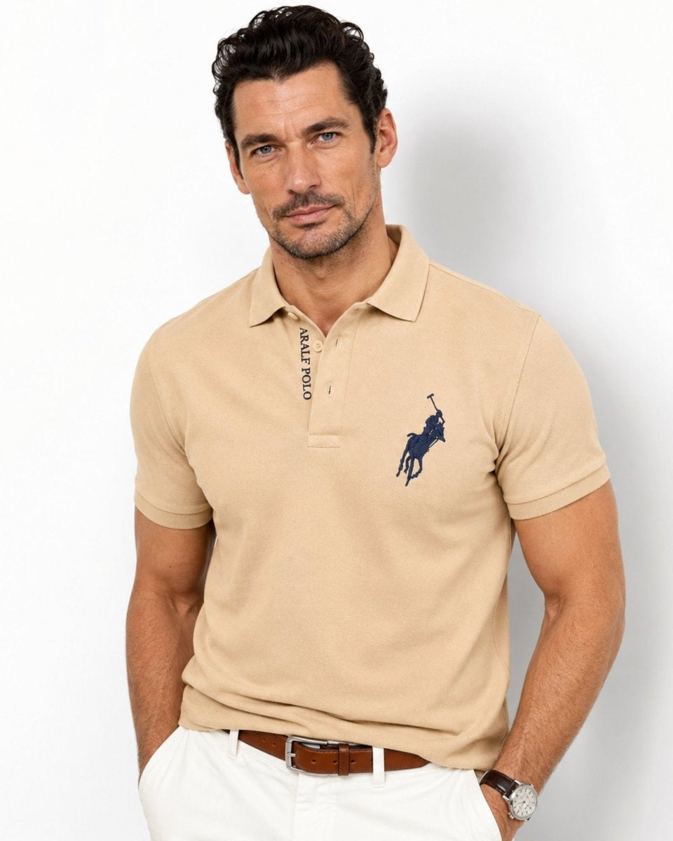 Man wearing a beige Polo Ralph Lauren shirt with a logo on a white background