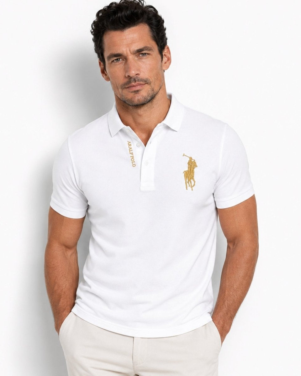Man wearing a white polo shirt with a logo on a light gray background