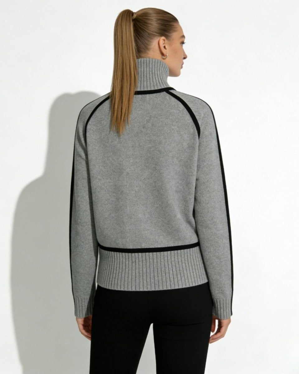 Back view of the gray raglan sleeve turtleneck with black contrast trim